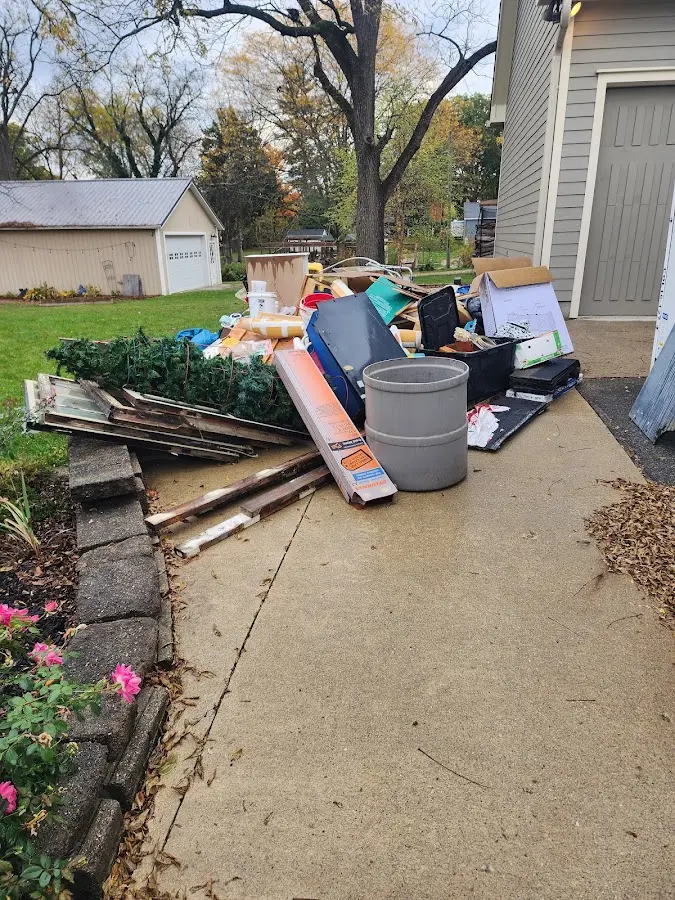 Dumpster being loaded with debris for Estate Cleanout Dumpster Rental in El Monte